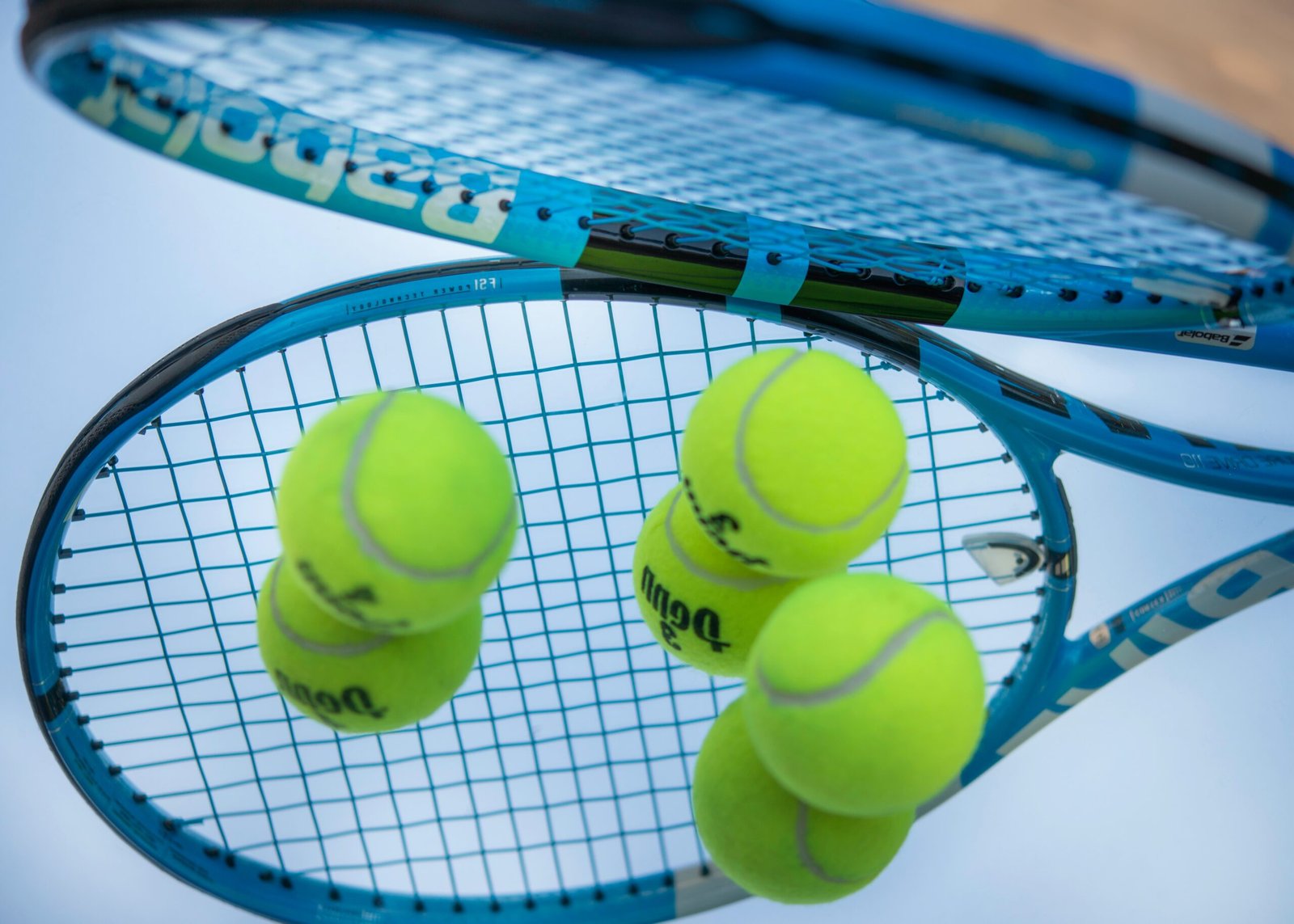 green tennis ball on white net