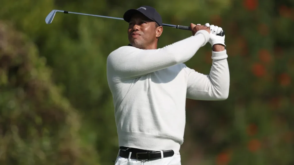 Tiger Woods tees off the fourth hole during the first round of the Genesis Invitational. Michael Owens/Getty Images